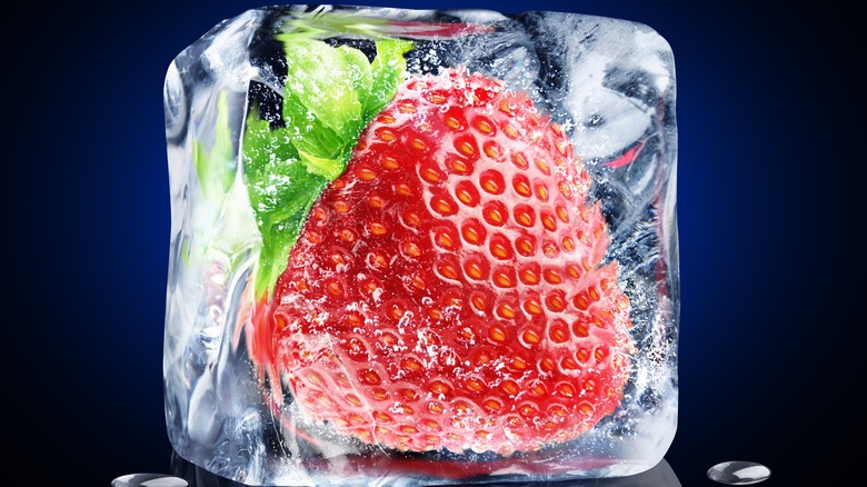 Strawberry frozen in ice cube