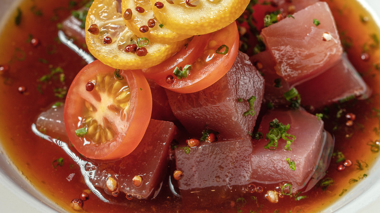 Tuna cubes tomatoes in marinade