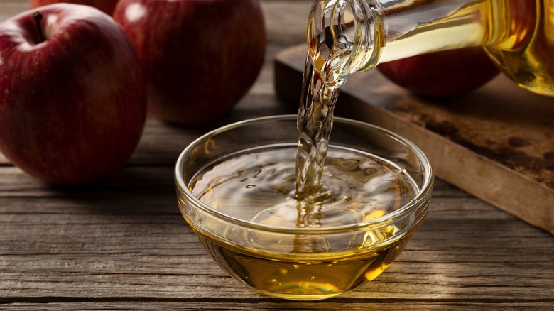 Apple cider vinegar poured into bowl