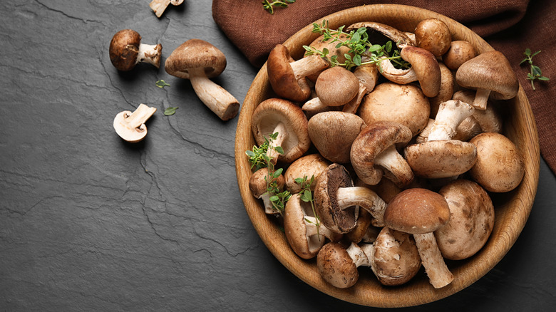 Wooden bowl with mushrooms