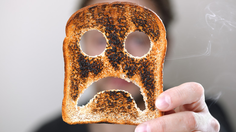 Burnt toast with a frown face