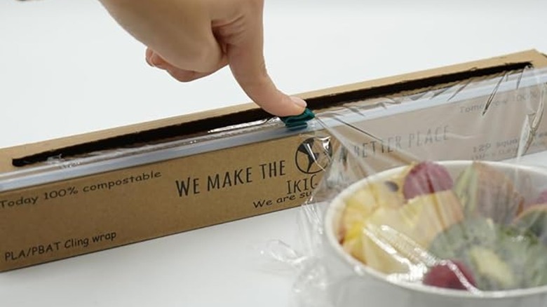 using slide cutter on box of plastic wrap to wrap fruit bowl