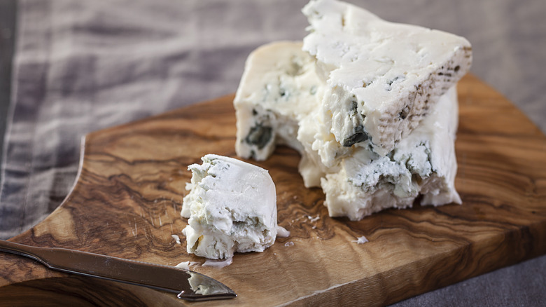 sliced blue cheese on board