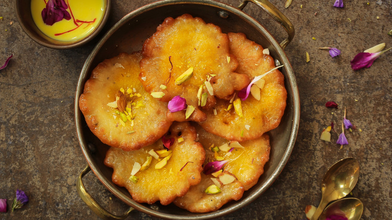 Malpua with nuts and petals