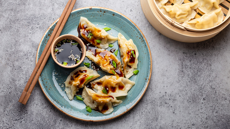 Steamed dumplings on blue plate