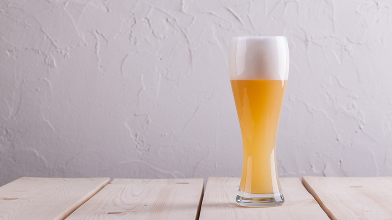 Hefeweizen in glass on wooden table