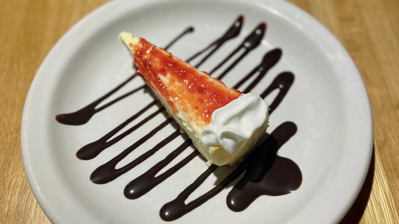 Cheesecake with chocolate sauce on plate