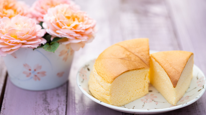 Japanese-style cheesecake on floral plate with flowers