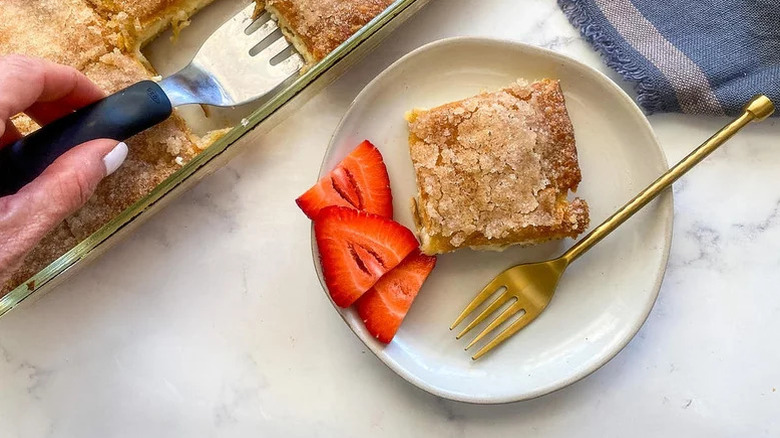 Slice of sopapilla cheesecake on a plate