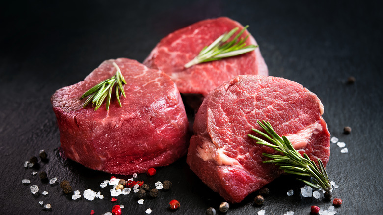 Raw filet mignon with rosemary