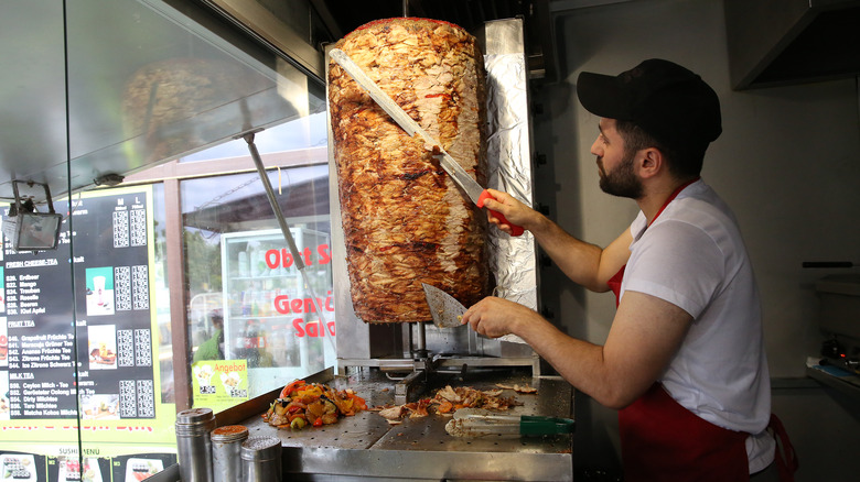 Man slicing doner kebab