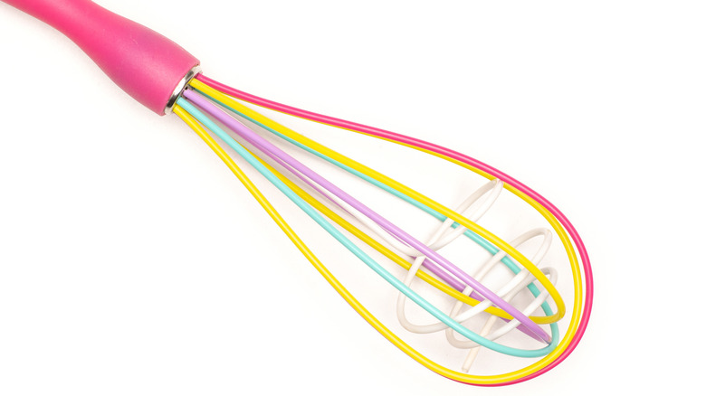 colorful "double" whisk against white background