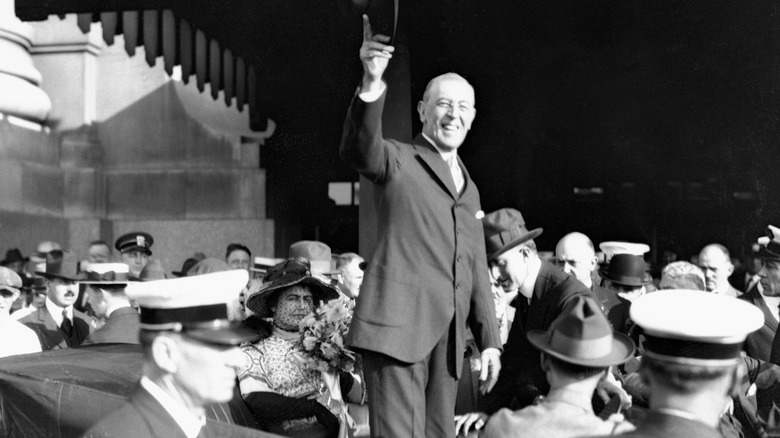 Woodrow Wilson standing in car