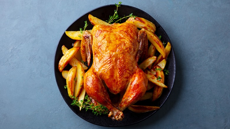 Roasted turkey with fries on platter