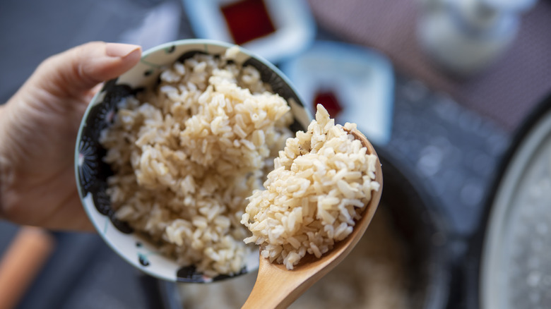 Bowl of rice in hand