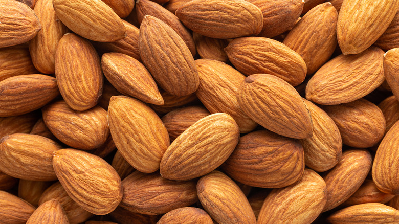 Close-up of a heap of unpeeled, raw almonds