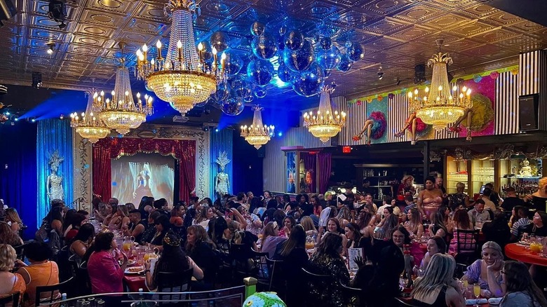 Chandeliers hanging in dinner theater dining room