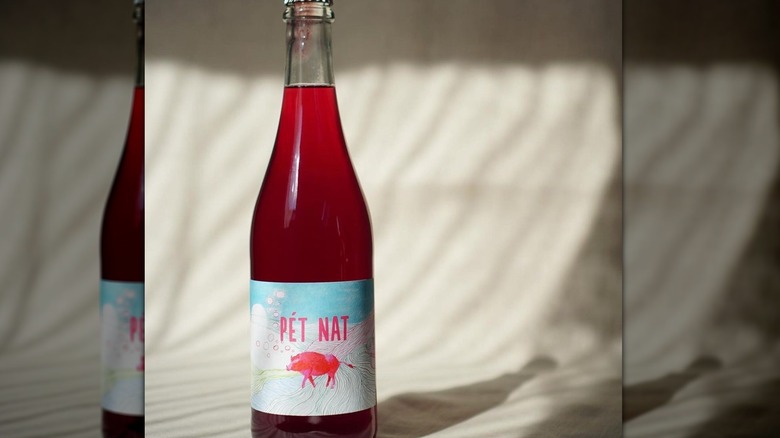 raspberry color wine in bottle