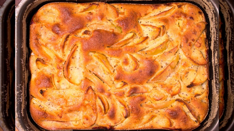 Overhead view of a baked apple pan dowdy with poppy seeds