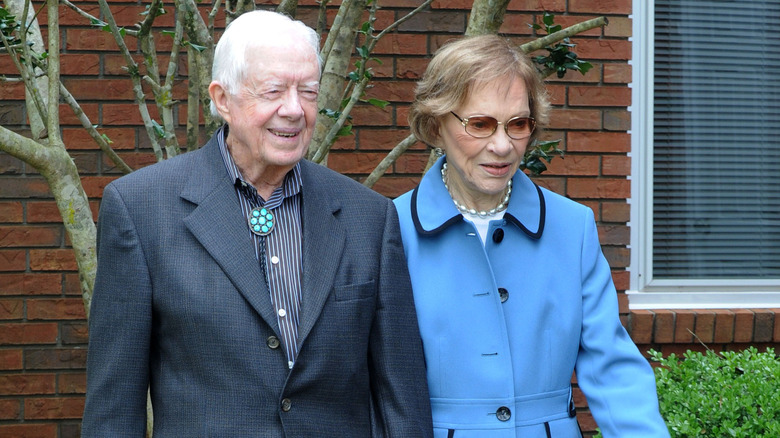 President Carter and his wife walking in Plains, GA