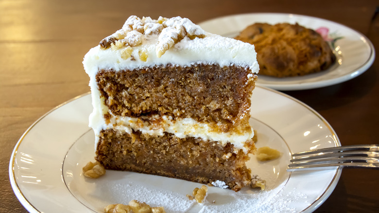 Carrot cake on plate with cream cheese icing