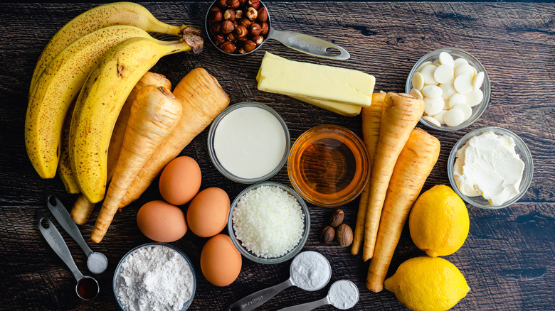 Parsnip and banana cake ingredients on wooden surface