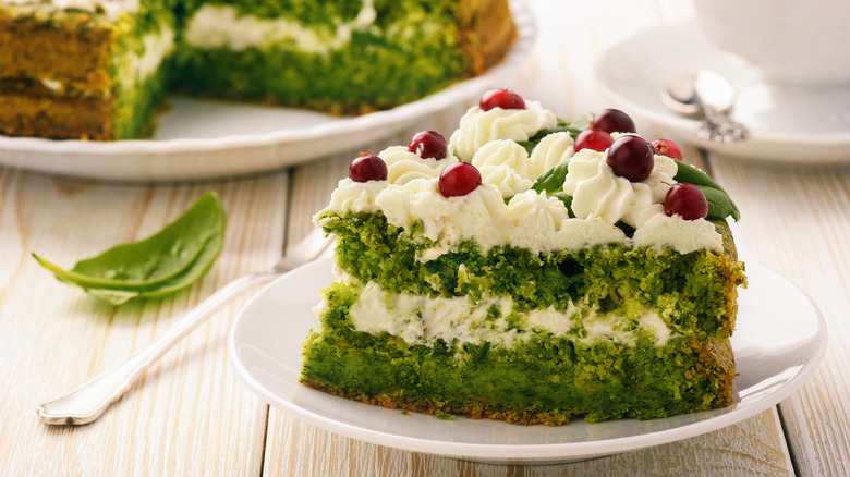 Spinach cake with cranberries and white icing