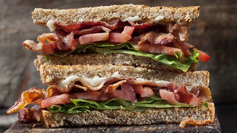 BLT sandwich on brown background 