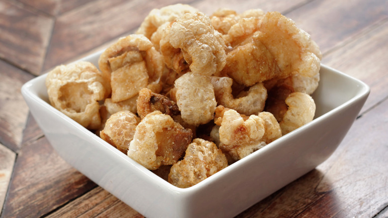 Pork rinds in white bowl 