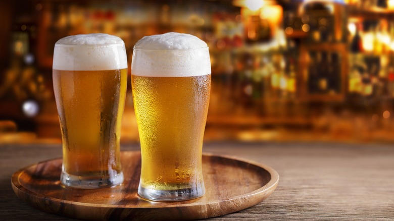 two beers on wooden bar