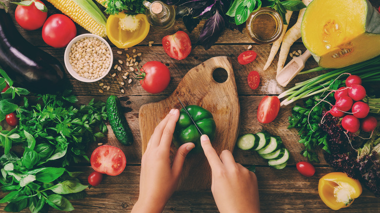 chopping bell pepper vegetables herbs