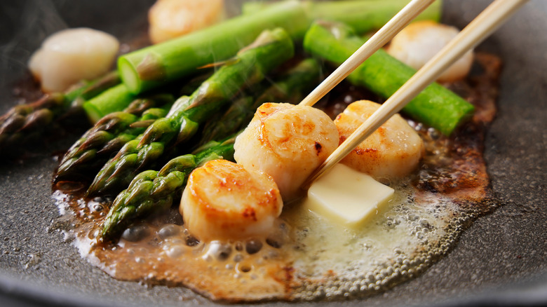 scallops in a pan with butter