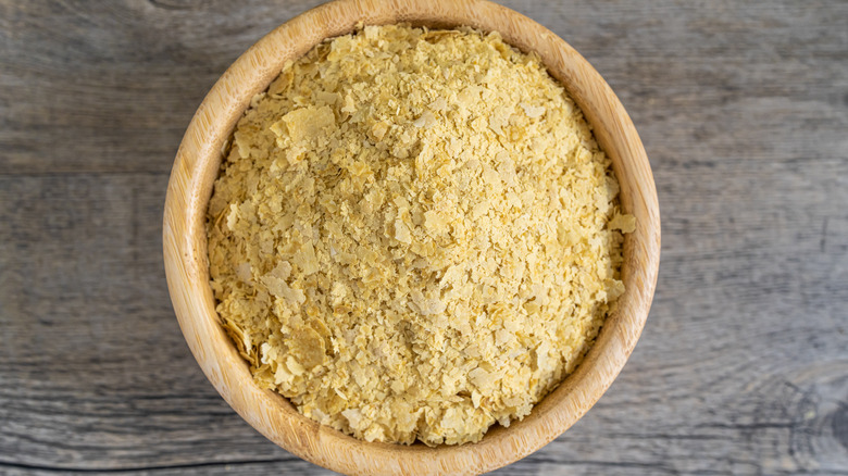 nutritional yeast in wooden bowl 