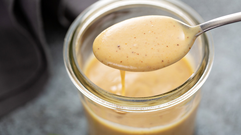 honey mustard spoon over jar