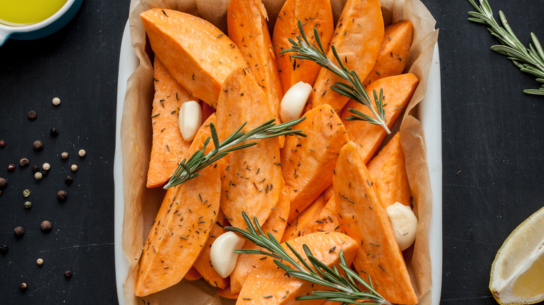 Uncooked garlic rosemary yams 