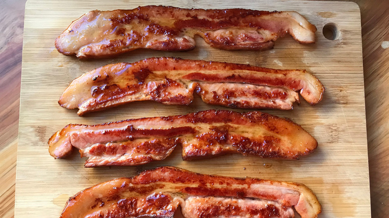 bacon strips on cutting board