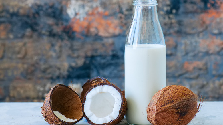 Coconuts with bottle of milk