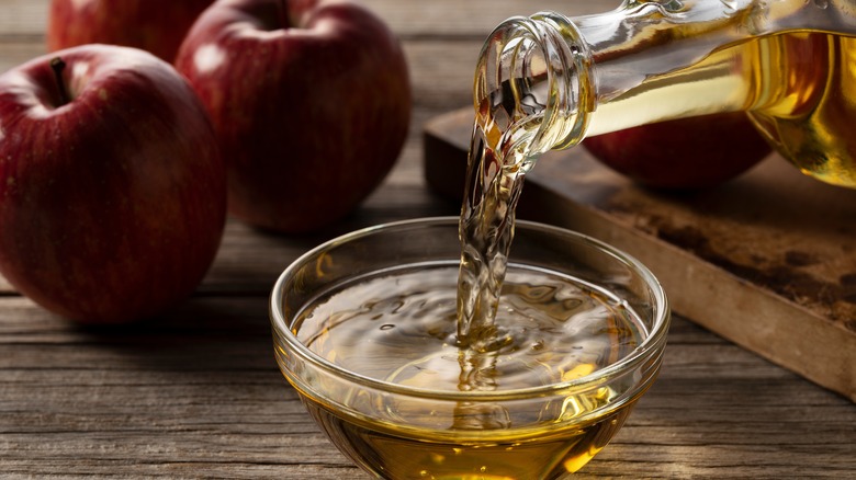 Vinegar pouring into bowl