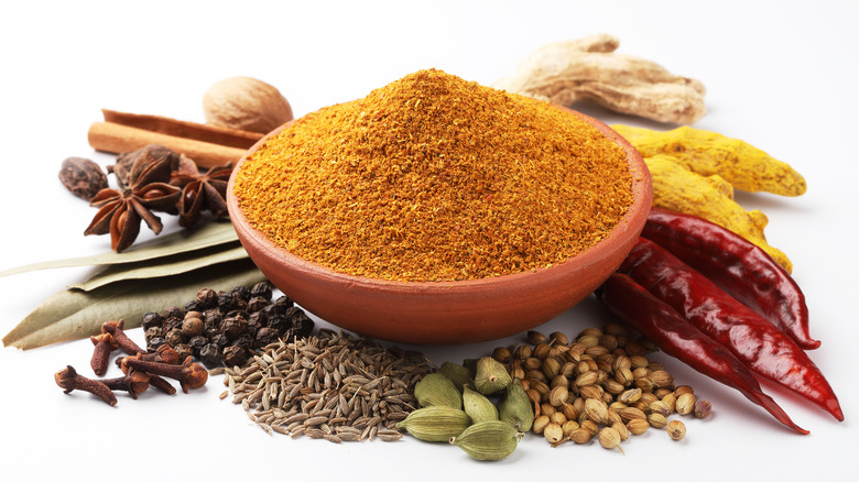 Various spices on white background