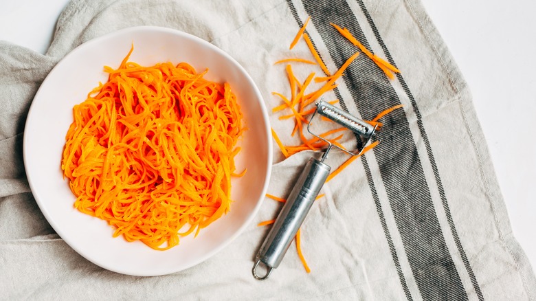 Shredded carrots and peeler