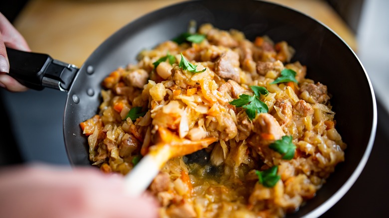 Cabbage dish cooking in pan