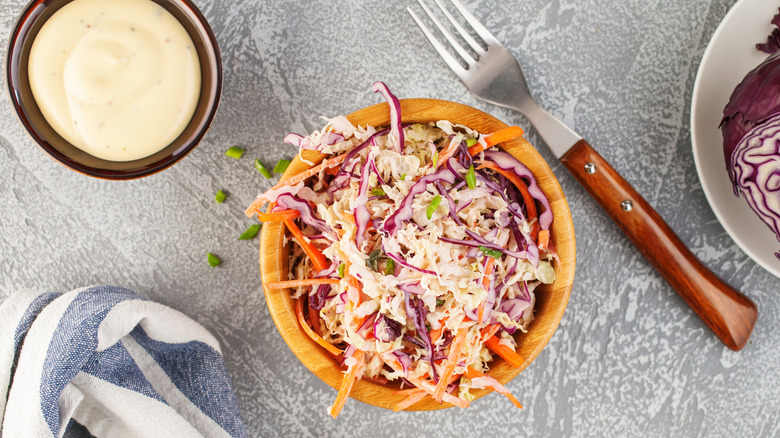 Coleslaw and dressing in bowls