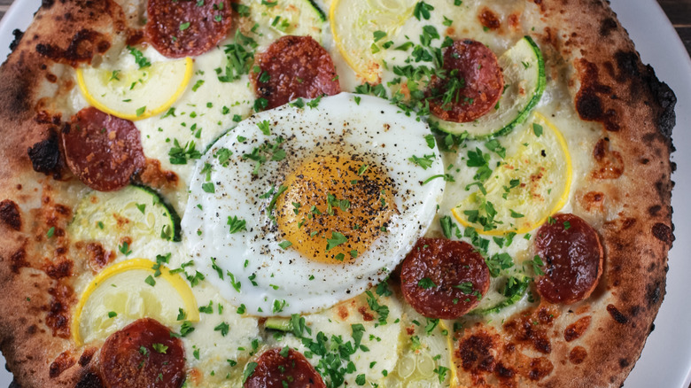 Baked eggs on a pizza