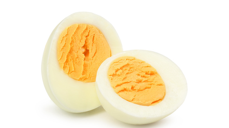 Hard-boiled eggs on white background