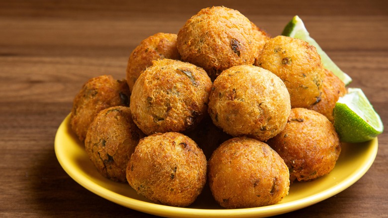 Round fritters on yellow plate 