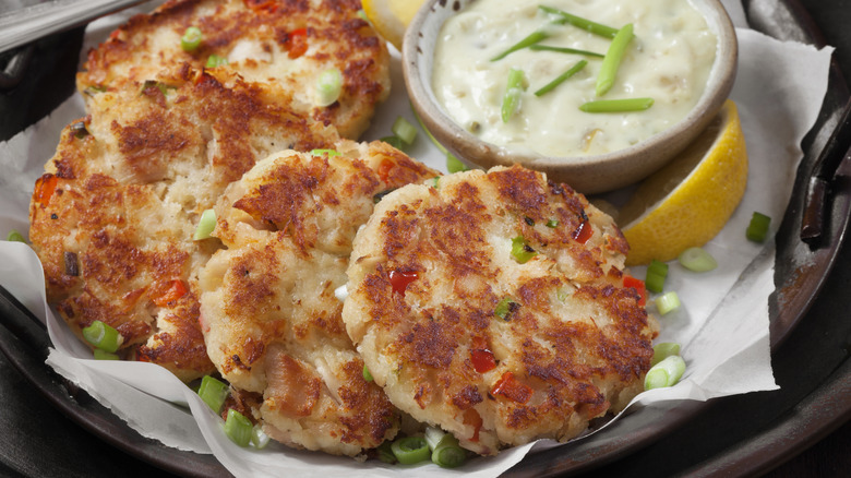 Fish cakes with dill sauce in dish