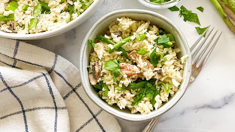 Cauliflower rice risotto with veggies in bowl