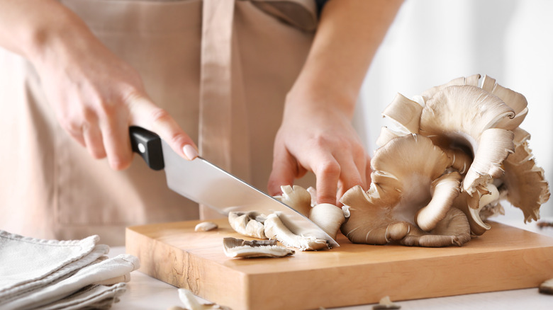 Cutting oyster mushrooms