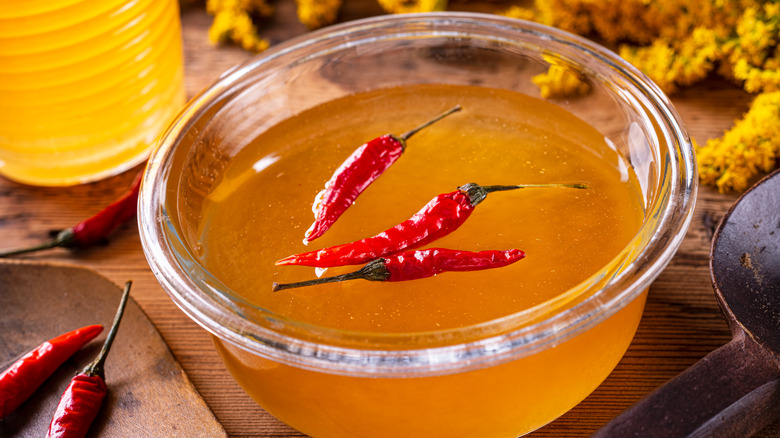 Chili infused honey in a glass bowl