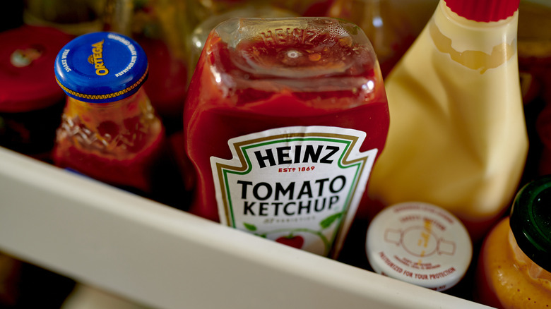 assorted condiments in refrigerator door